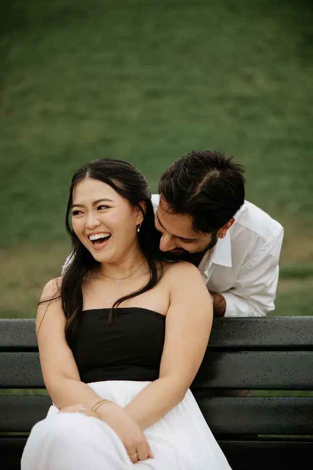 First frame, both laughing.