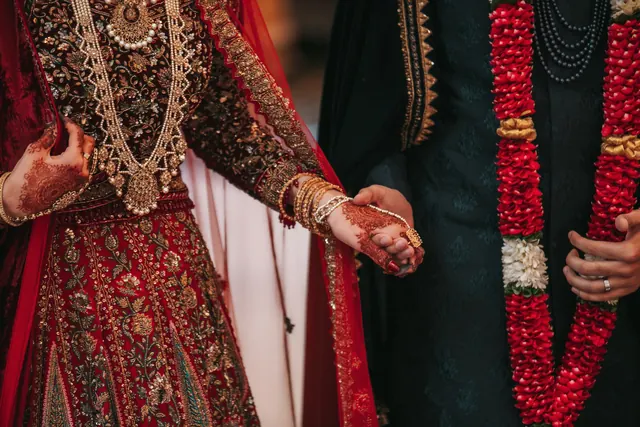 Hands joined, in red.